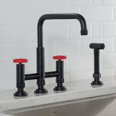 KRAUS Urbix Bridge Kitchen Faucet with Side Sprayer in Matte Black/Red - KPF-3125MBRD